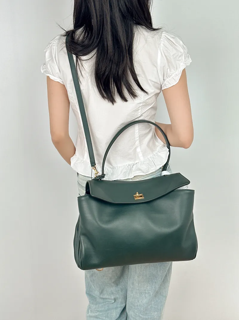 BALENCIAGA Crossbody Bag RODEO Green Calfskin Medium35 × 11 × 23.5 cm — on-model view 1 of 2