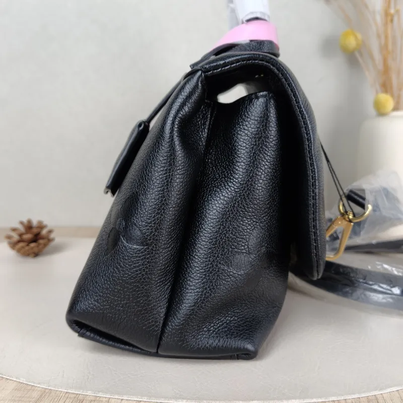Louis Vuitton Crossbody Bag MADELEINE Black Monogram Empreinte Embossed Calfskin Medium 30 × 11 × 19.5 cm — detail view 10 of 11