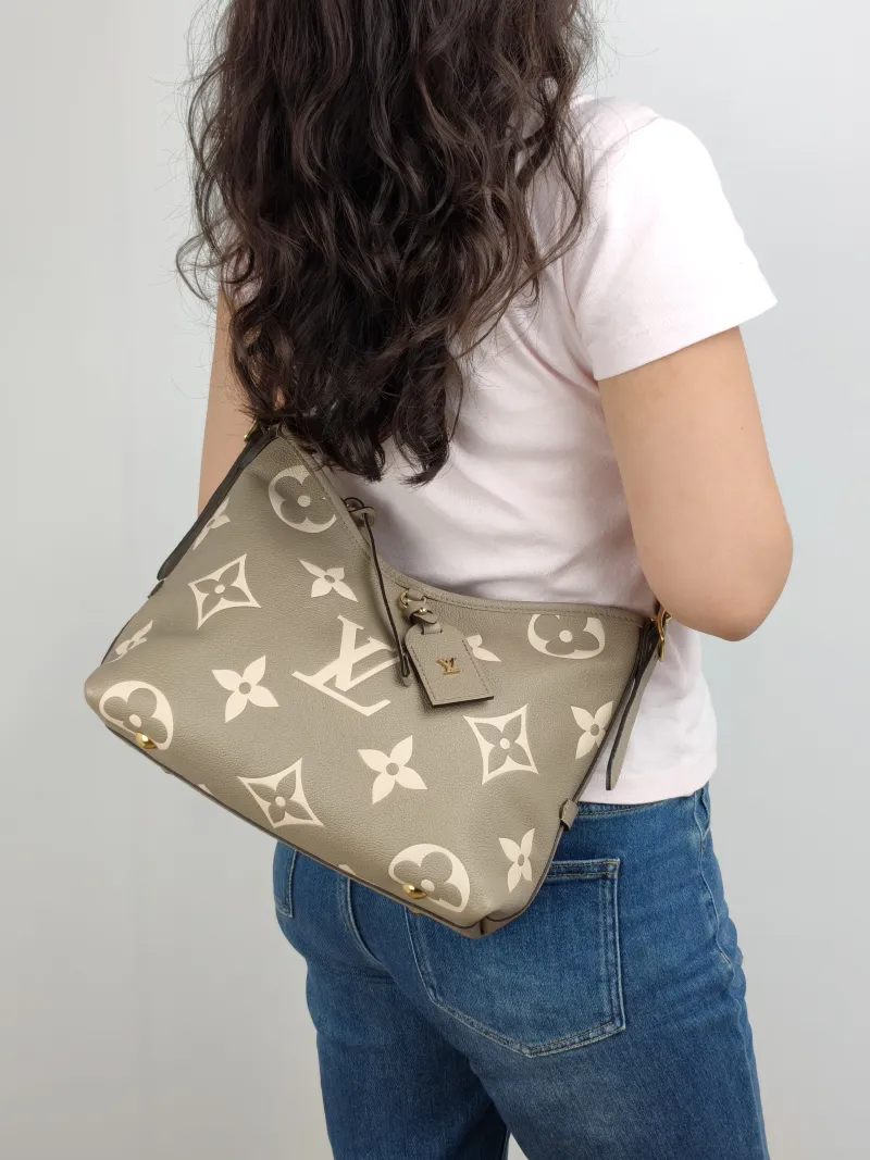 Louis Vuitton Crossbody Bag Carryall Calfskin Small 29.5 × 12 × 24 cm — on-model view 1 of 2