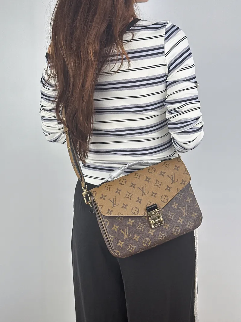 Louis Vuitton Crossbody Bag Pochette Métis Monogram Colorblock PVC Medium25 × 7 × 19 cm — on-model view 2 of 2