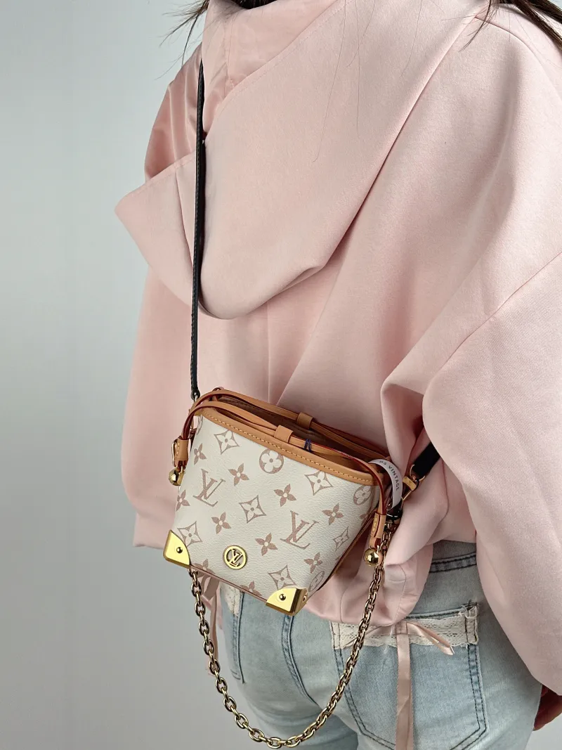 Louis Vuitton Crossbody Bag NOÉ PURSE LV CHARMS PVC Mini 11.5 × 11.5 × 11.5 cm — on-model view 1 of 2