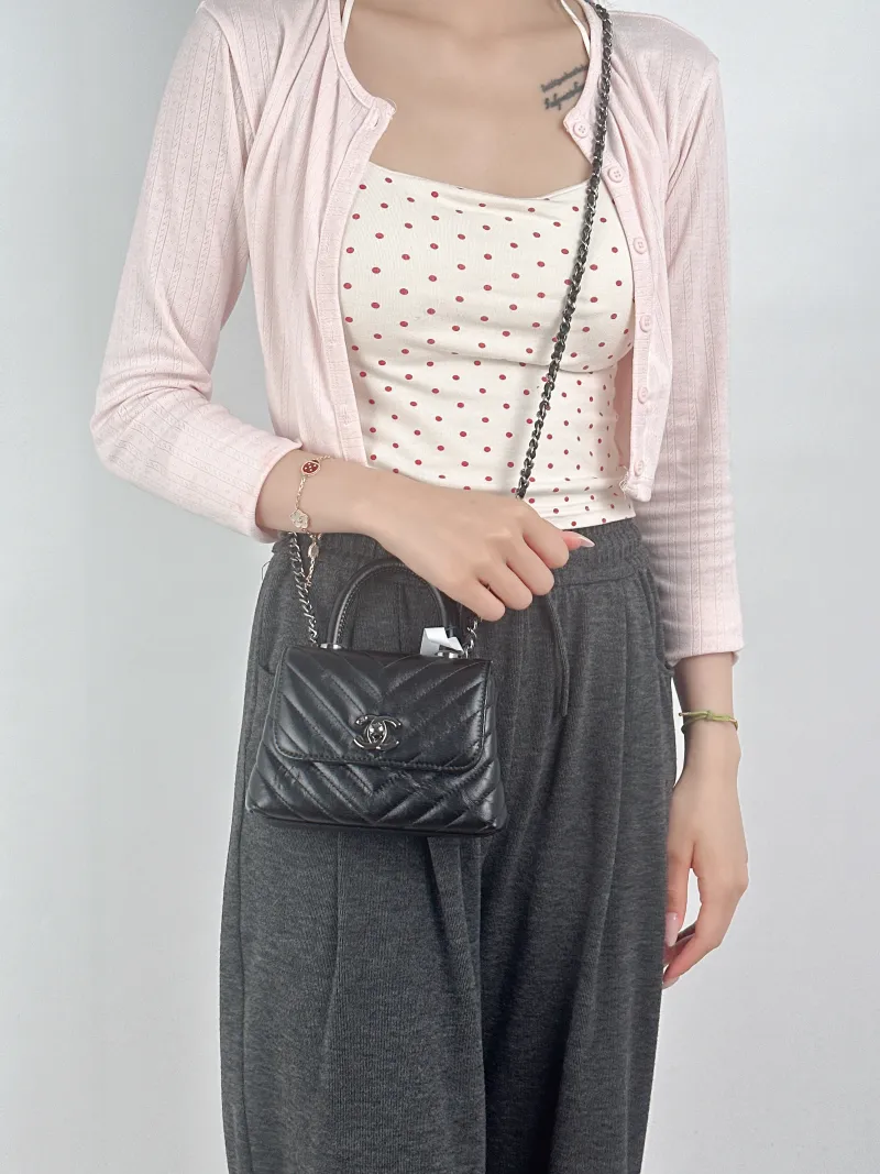 Chanel Crossbody Bag Coco Handle​Black V Calfskin Mini14.5 × 5.5 × 11.5 cm — on-model view 3 of 3