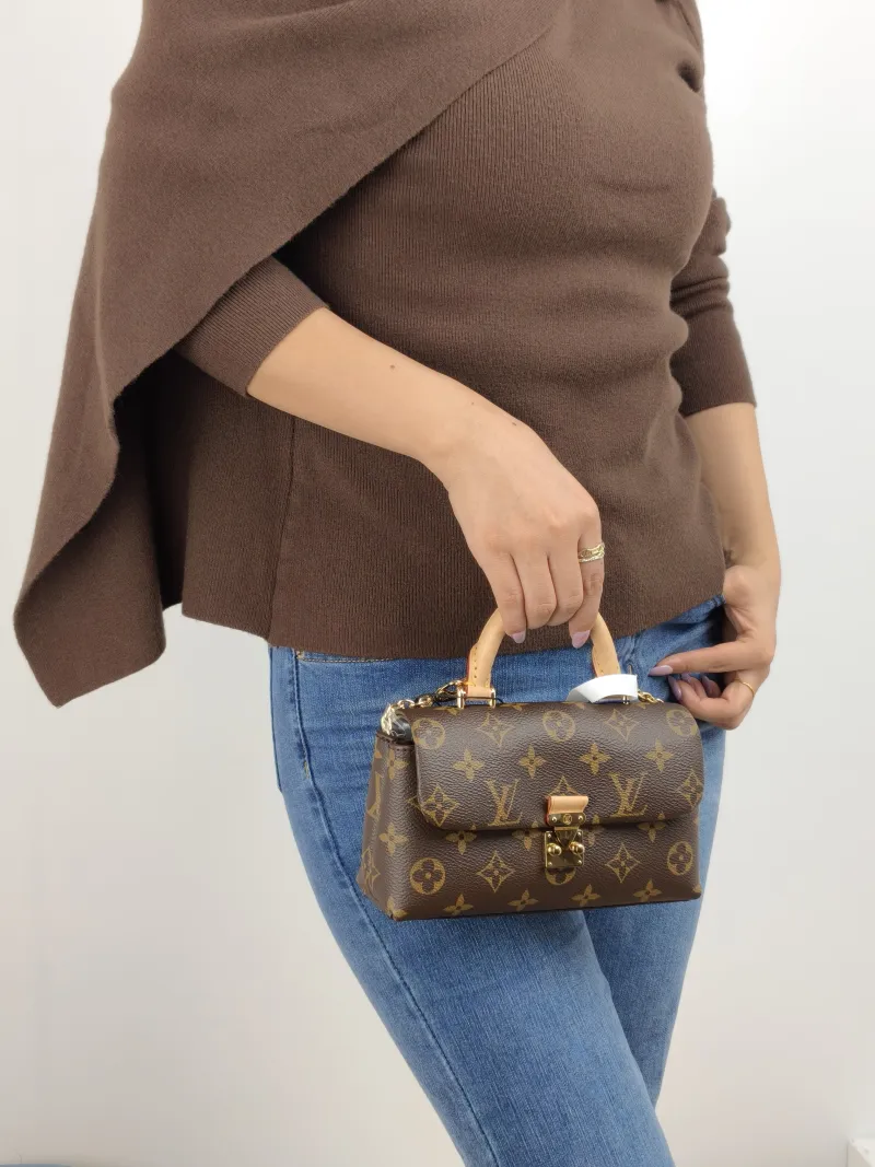 Louis Vuitton Crossbody Bag MADELEINE Monogram PVC nano 21 × 6 × 12.5 cm — on-model view 1 of 2