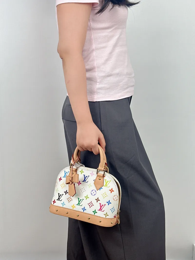Louis Vuitton Crossbody Bag Alma BB Multicolore PVCBB23.5 × 11.5 × 17.5 cm — on-model view 1 of 2
