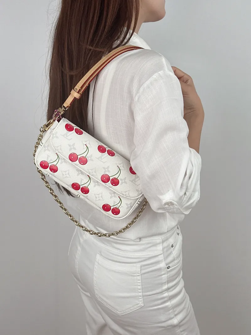 Louis Vuitton Crossbody Bag IVY White · PVC Small 23.5 × 4.3 × 12 cm — on-model view 2 of 2