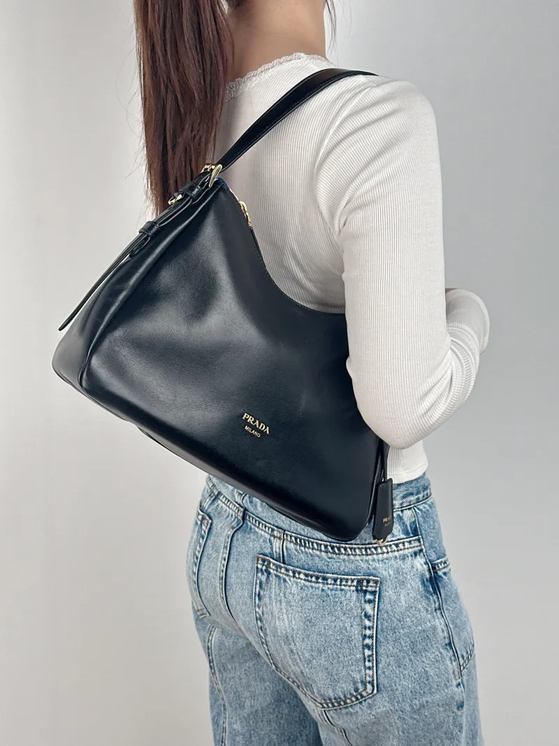 PRADA Shoulder Bag Aimée Black Calfskin 30 × 10 × 22 cm — on-model view 2 of 2