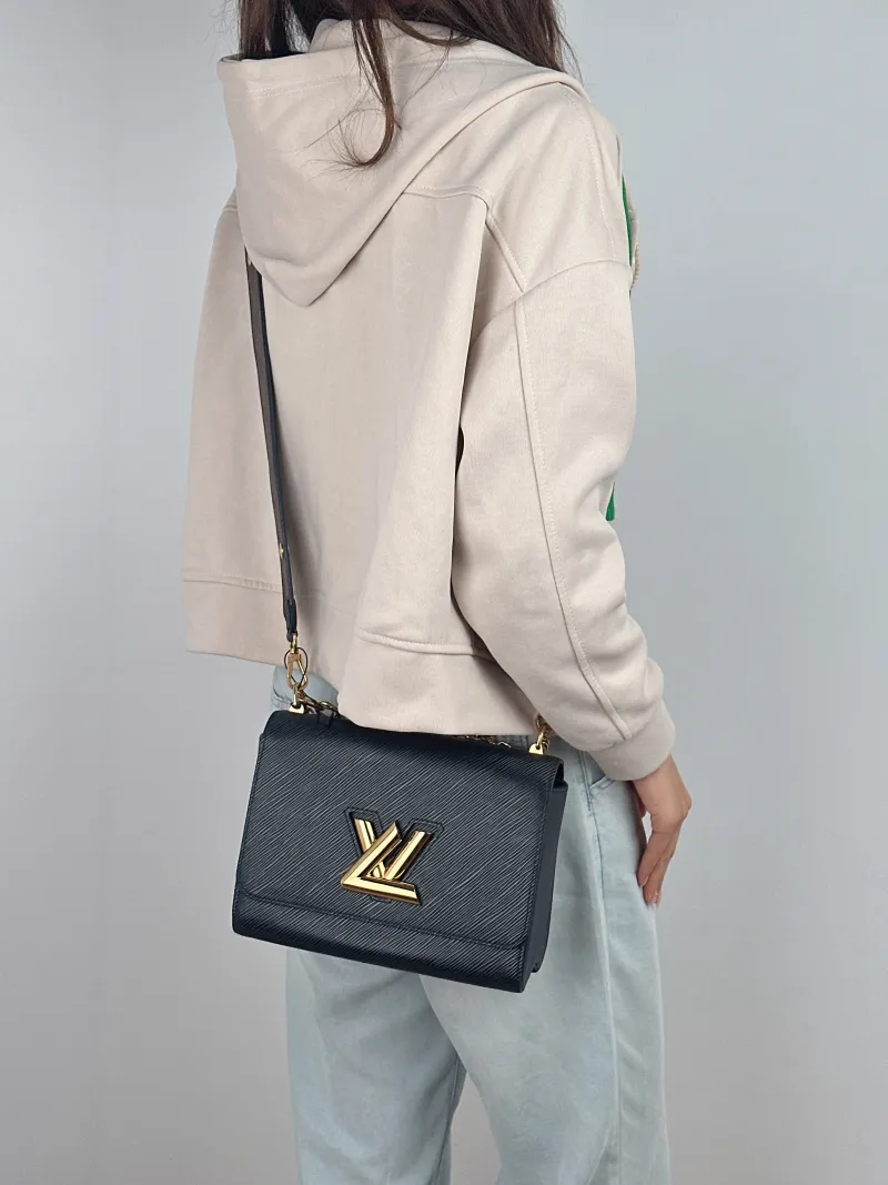Louis Vuitton Crossbody Bag Twist Black Epi Embossed Calfskin Medium 23 × 9.5 × 17 cm — on-model view 2 of 2
