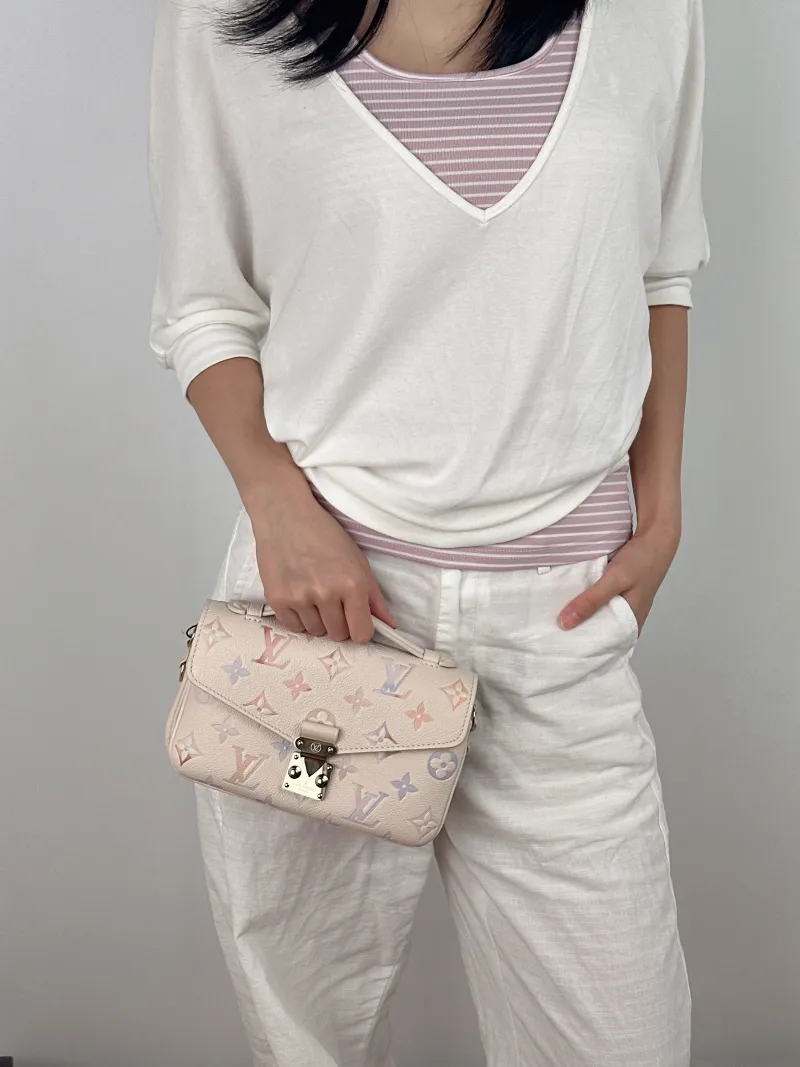 Louis Vuitton Crossbody Bag Pochette Métis East West Empreinte Embossed Calfskin Small 21.5 × 6 × 13.5 cm — on-model view 1 of 4