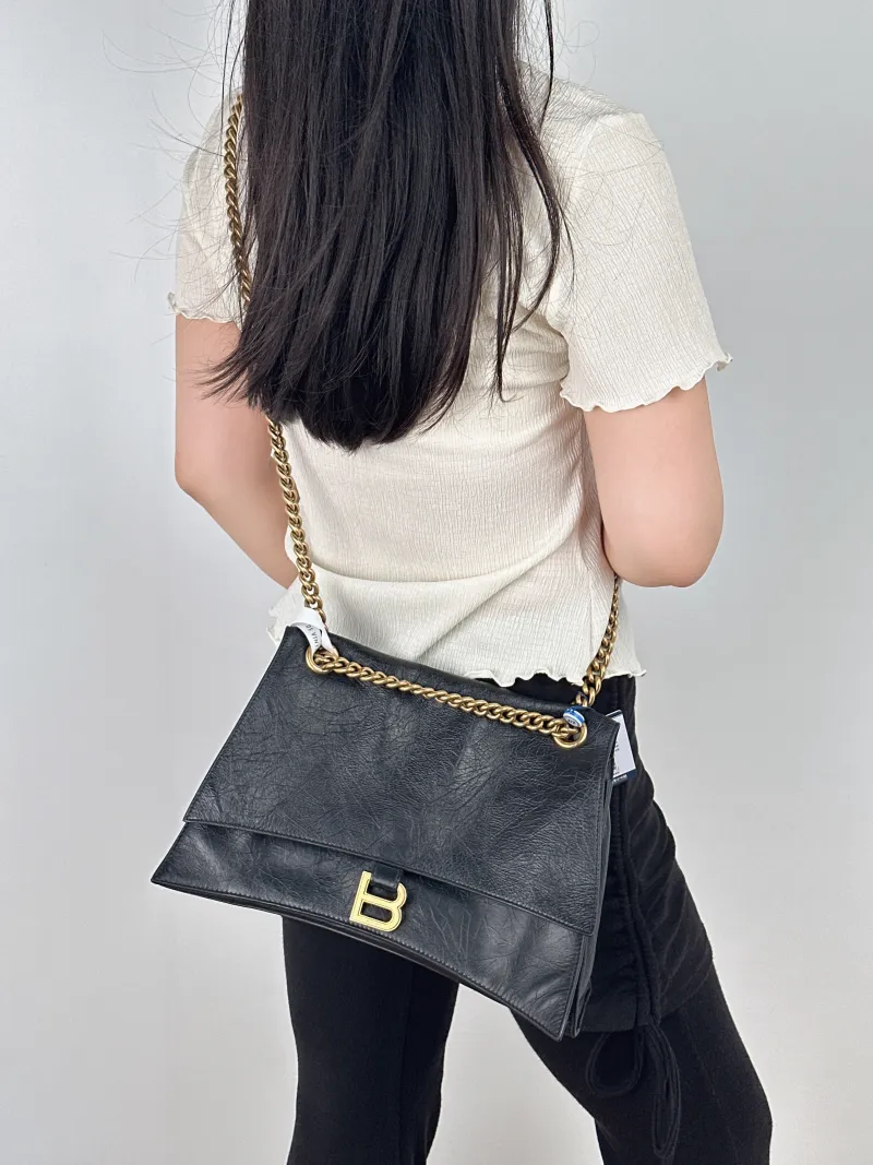BALENCIAGA Shoulder Bag CRUSH Chain Bag Black CC alfskin Medium30 × 13 × 20 cm — on-model view 2 of 2