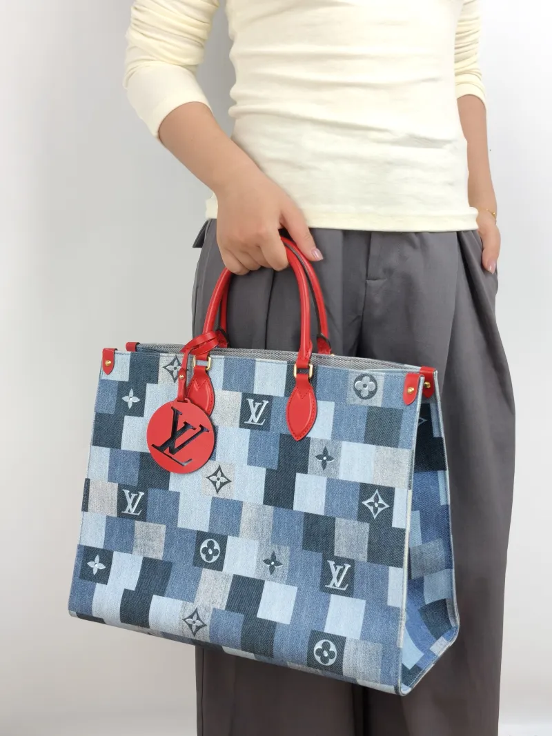 Louis Vuitton Top Handle Bag Onthego Large Blue Red Large 41 × 19 × 34 cm — on-model view 1 of 2