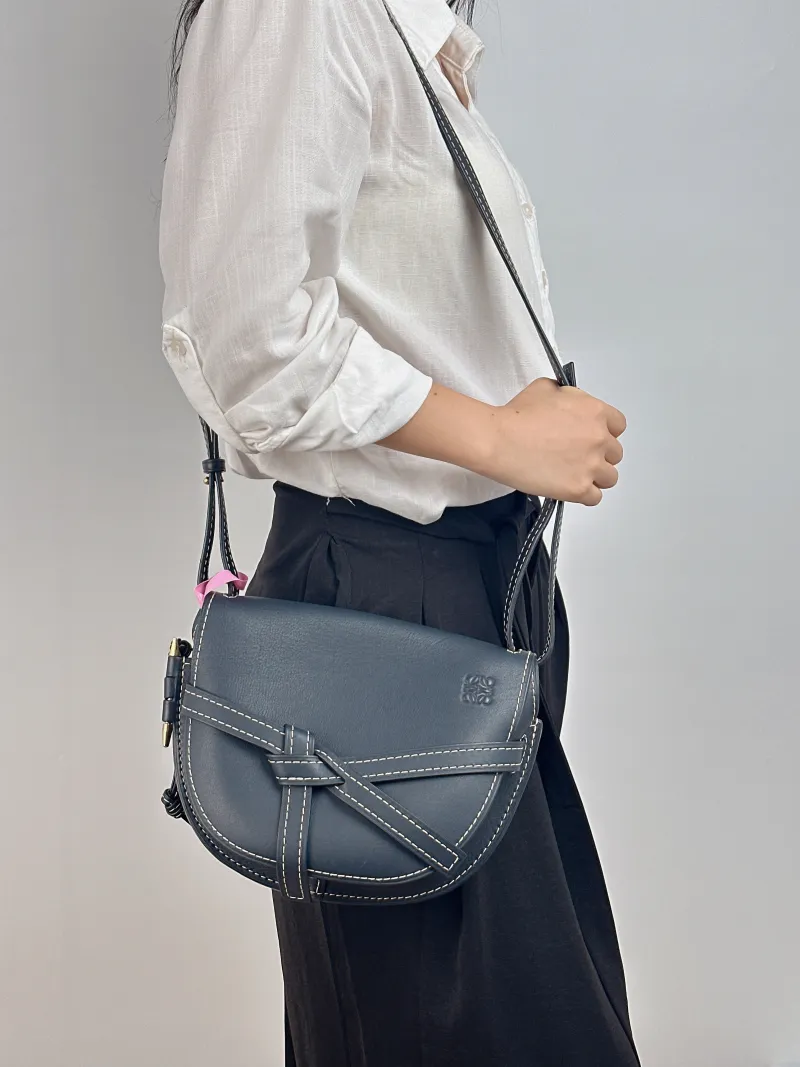 LOEWE Crossbody Bag Gate Black Calfskin Medium 25 × 11.5 × 19 cm — on-model view 1 of 2