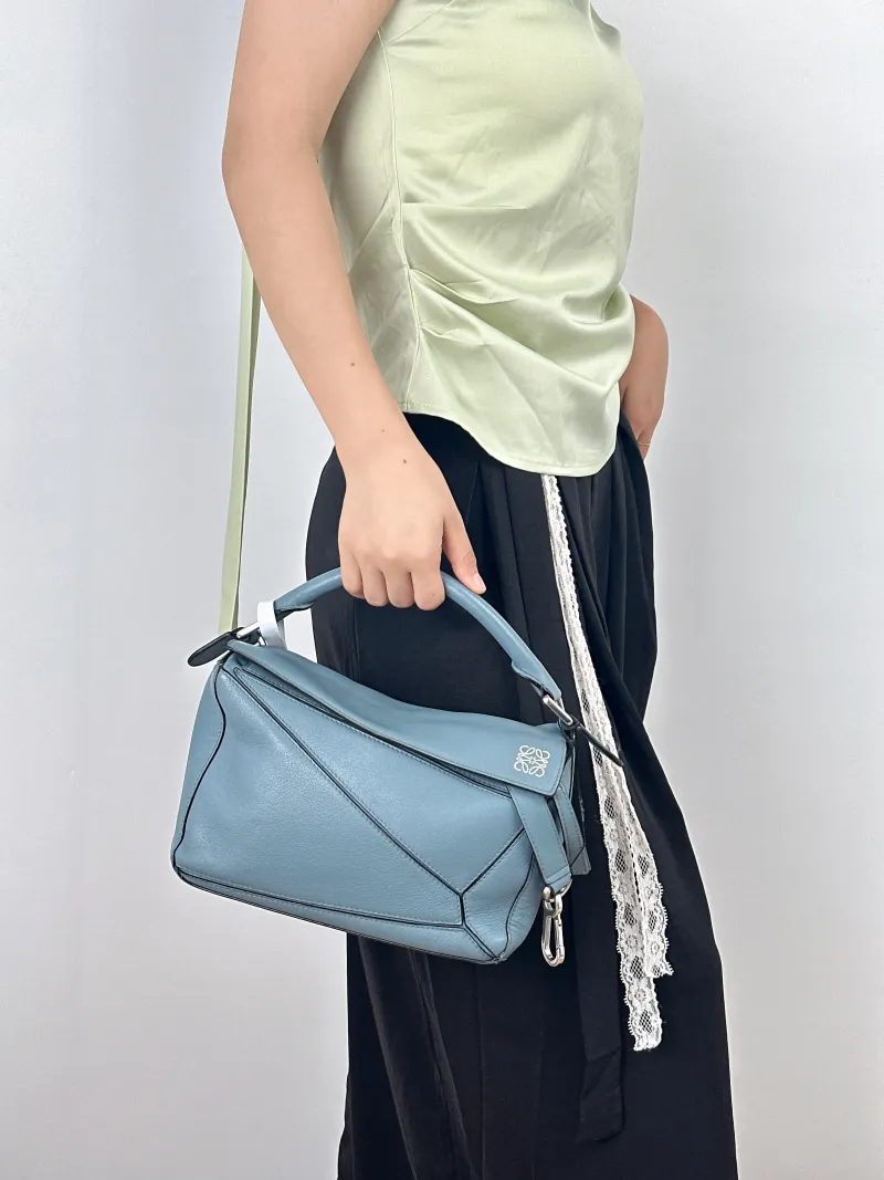LOEWE Crossbody Bag Puzzle Blue CC alfskin Small24 × 10.5 × 16.5 cm — on-model view 1 of 2