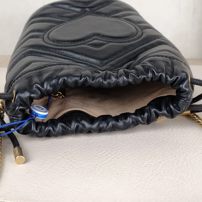 GUCCI Crossbody Bag GG Marmont Marmont Bucket Bag Black with Gold-Tone Hardware Calfskinmini13 × 10 × 17.5 cm — detail view 9 of 11