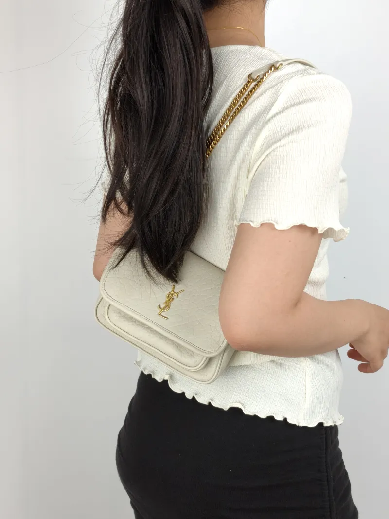 SAINT LAURENT Crossbody Bag Niki White Lambskin Mini 18 × 5 × 12.5 cm — on-model view 2 of 3