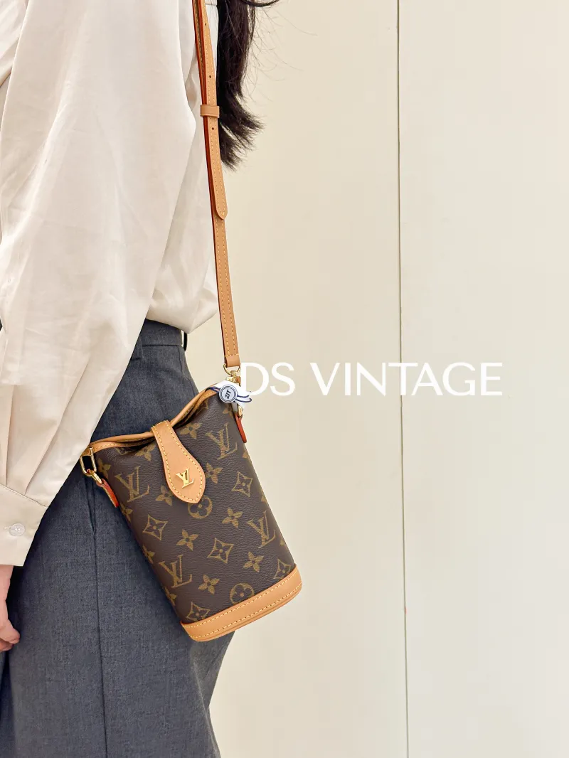 Louis Vuitton Crossbody Bag Fold Me Monogram PV Cmini14.5 × 6.5 × 18 cm — on-model view 3 of 3