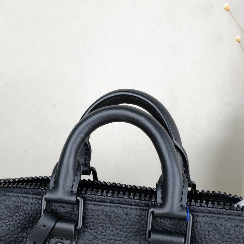 Louis Vuitton Crossbody Bag Keepall 25 Taurillon Embossed Calfskin Monogram Medium25 × 11 × 15 cm — detail view 3 of 12
