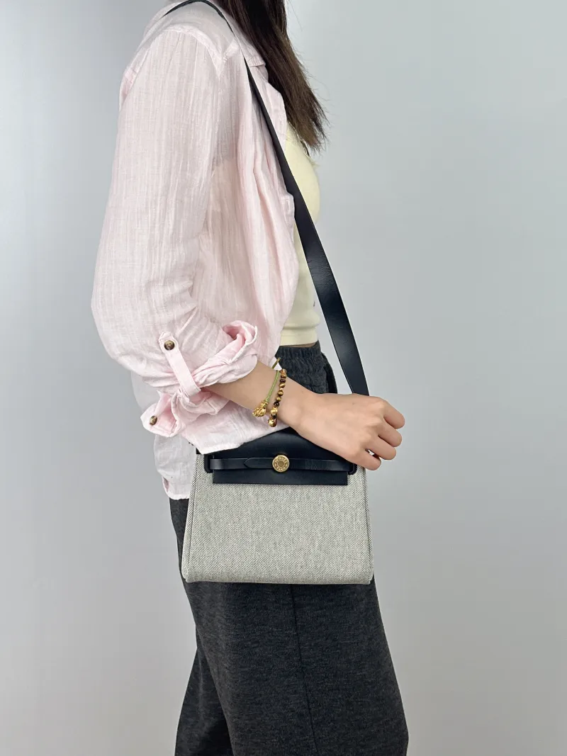 Hermès Crossbody Bag Herbag Zip 20Black Beige Canvas mini20.5 × 7 × 16.5 cm — on-model view 1 of 2