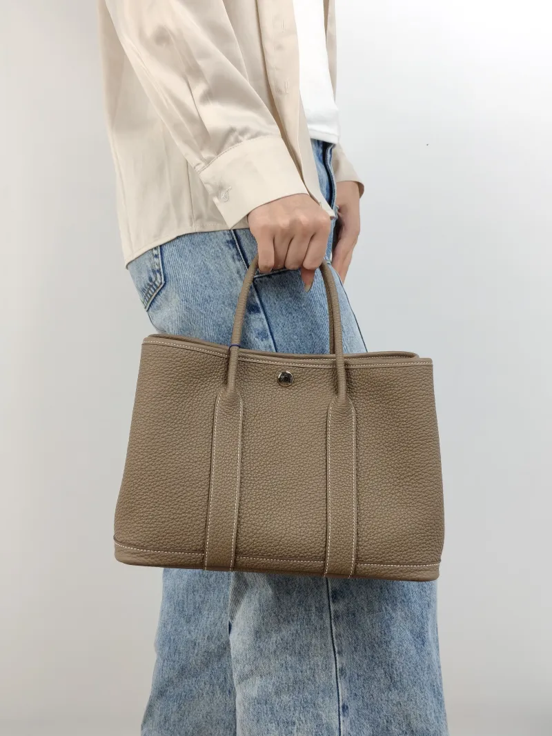 Hermès Top Handle Bag Garden Party 30 30 Negonda Calfskin Medium 30 × 13 × 21 cm G — on-model view 2 of 2