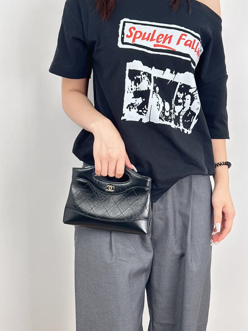 Chanel Shoulder Bag31Bag Black Waxed Leathernano20.5 × 3.5 × 17 cm — on-model view 1 of 3