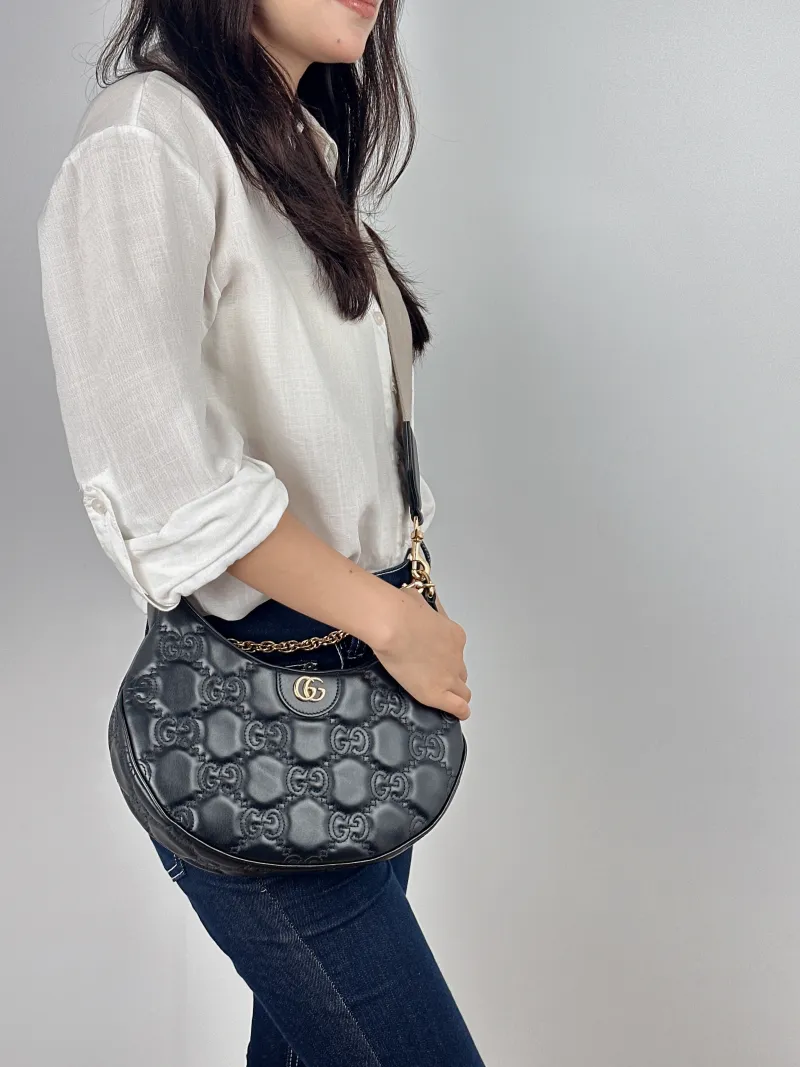 GUCCI Shoulder Bag GG matelasse Black Calfskin Small 27 × 7 × 18 cm — on-model view 1 of 2
