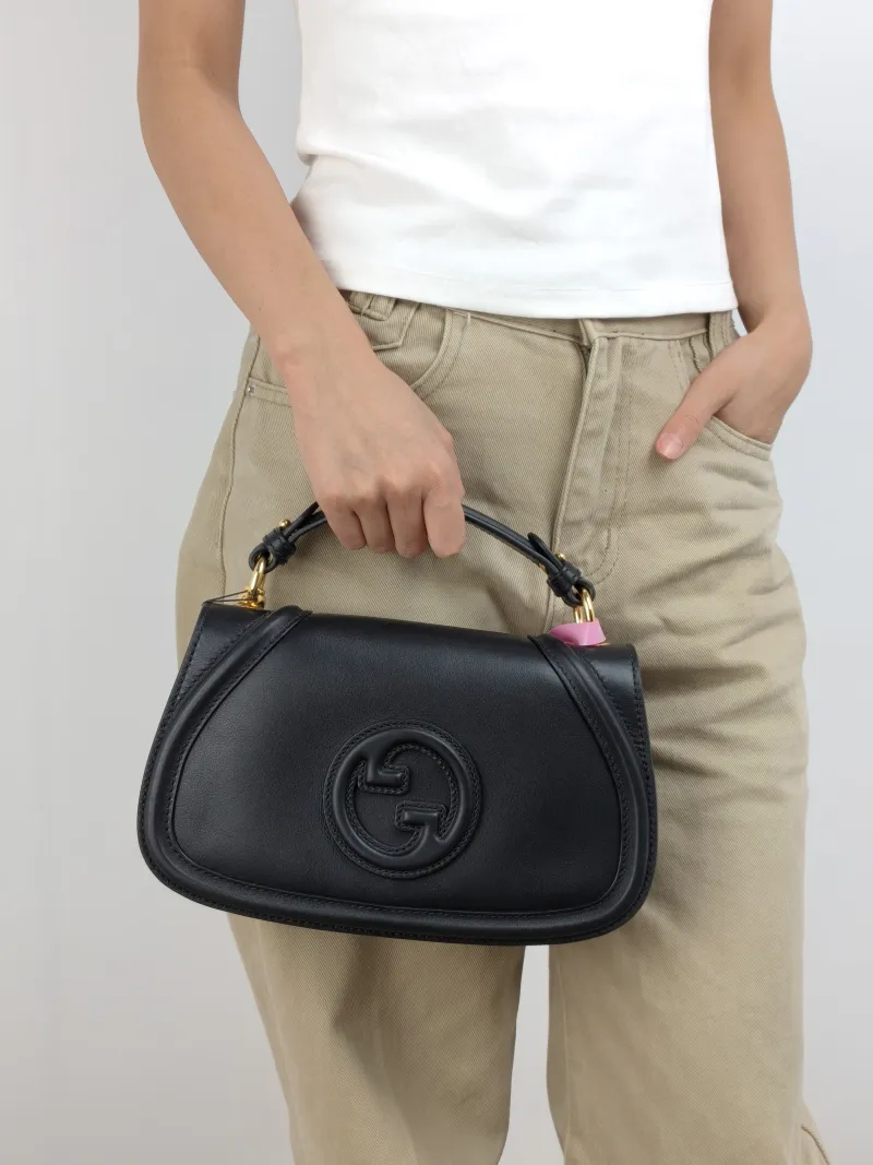 GUCCI Crossbody Bag blondie Top Handle Crossbody Bag Black Calfskin Small 26.5 × 8.5 × 16.5 cm — on-model view 1 of 3