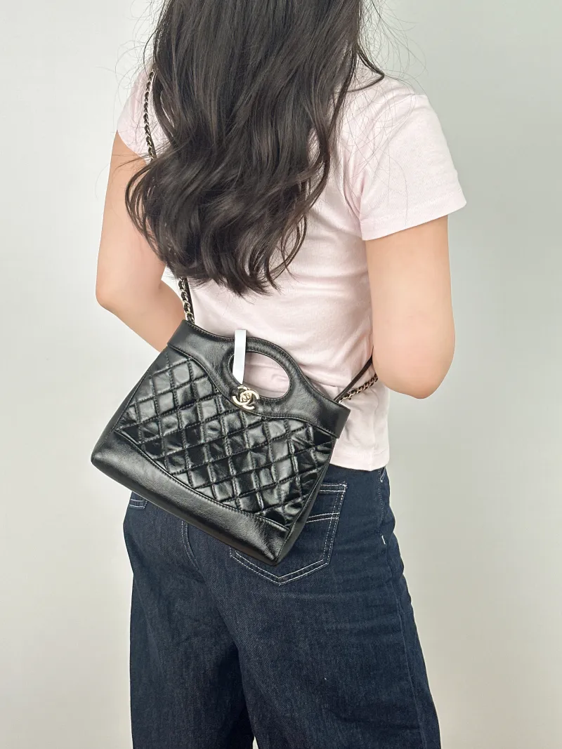 Chanel Crossbody Bag 31Bag Black Waxed Leather Mini 23 × 5.5 × 22 cm — on-model view 2 of 2