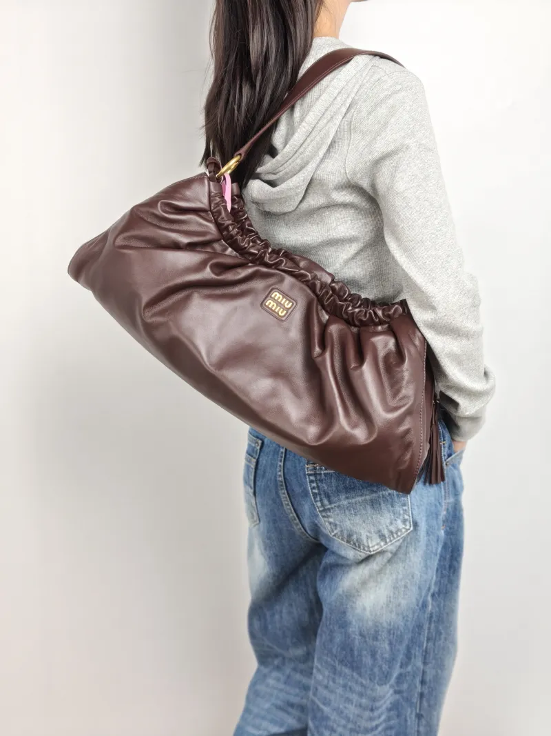 Miumiu Shoulder Bag Joie Shoulder Bag SL ambskin 53 × 9 × 25 cm — on-model view 1 of 2