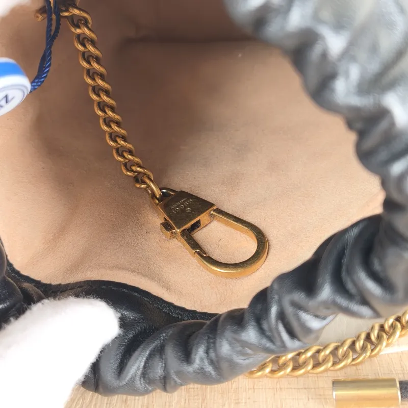 GUCCI Crossbody Bag GG Marmont Marmont Bucket Bag Black with Gold-Tone Hardware Calfskinmini13 × 10 × 17.5 cm — detail view 1 of 11