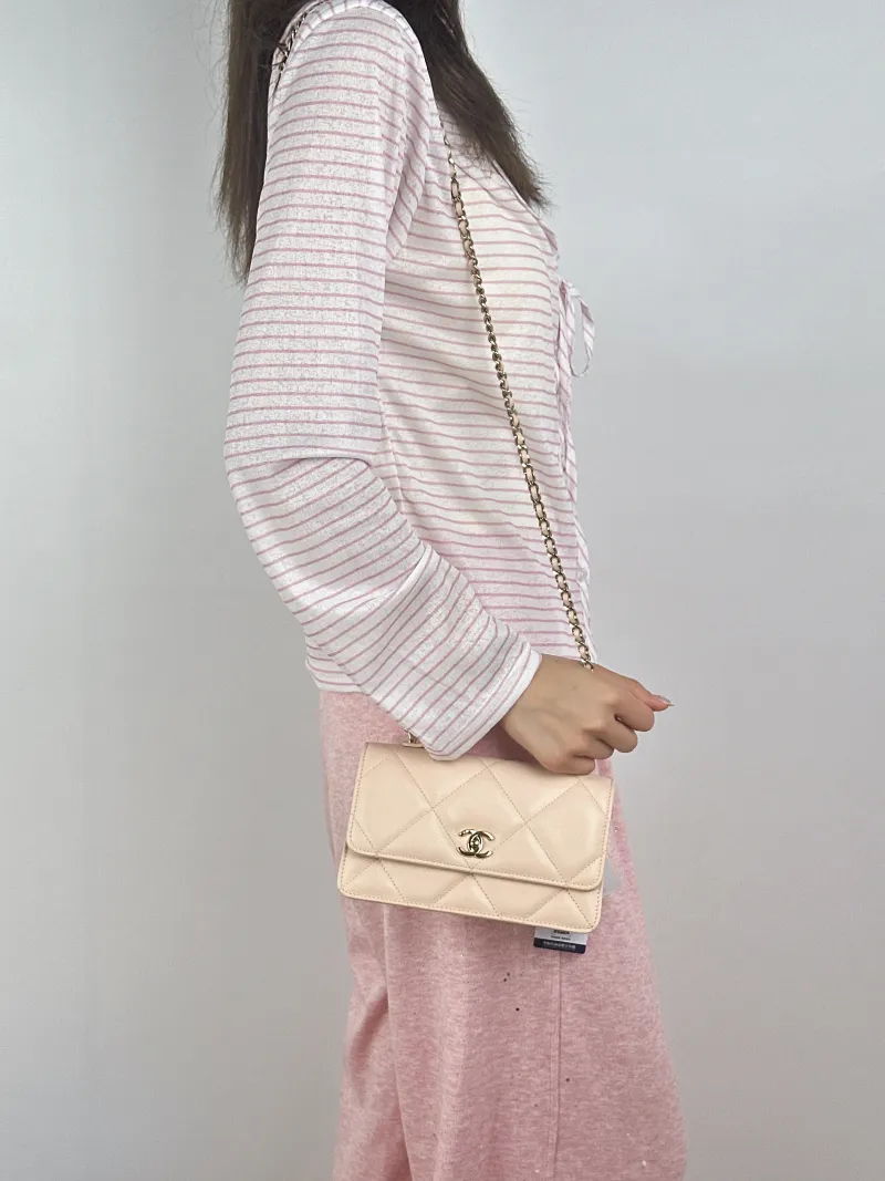 Chanel Crossbody Bag Edition woc Beige Calfskinmini19.2 × 7 × 12.3 cm — on-model view 1 of 3