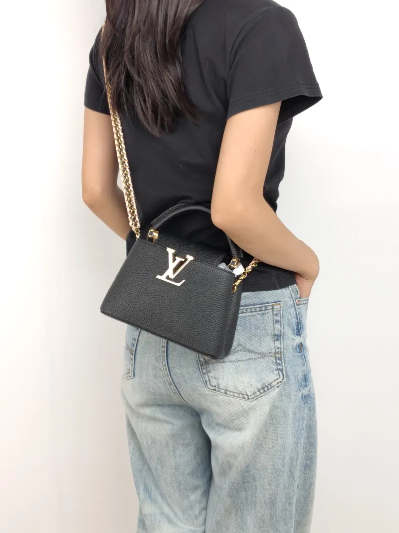 Louis Vuitton Shoulder Bag Capucines Black Pink Calfskin Mini 21 × 8 × 14 cm — on-model view 1 of 3
