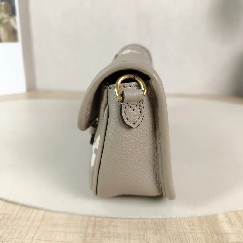 Louis Vuitton Crossbody Bag Diane Baguette Bag Empreinte Embossed Calfskin nano 19 × 6 × 10.5 cm — detail view 1 of 12