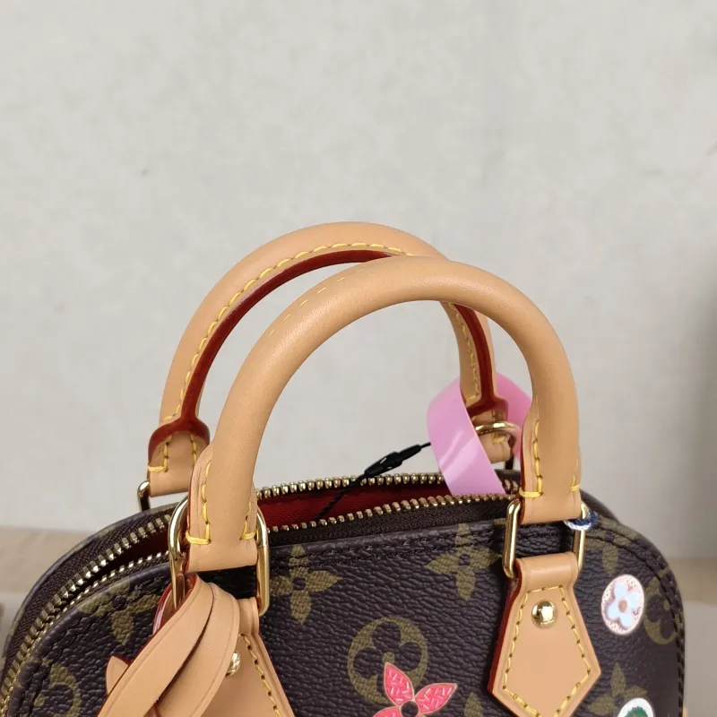 Louis Vuitton Crossbody Bag Alma Nano vivenne Monogram PVC nano 18 × 8 × 12 cm — detail view 9 of 11