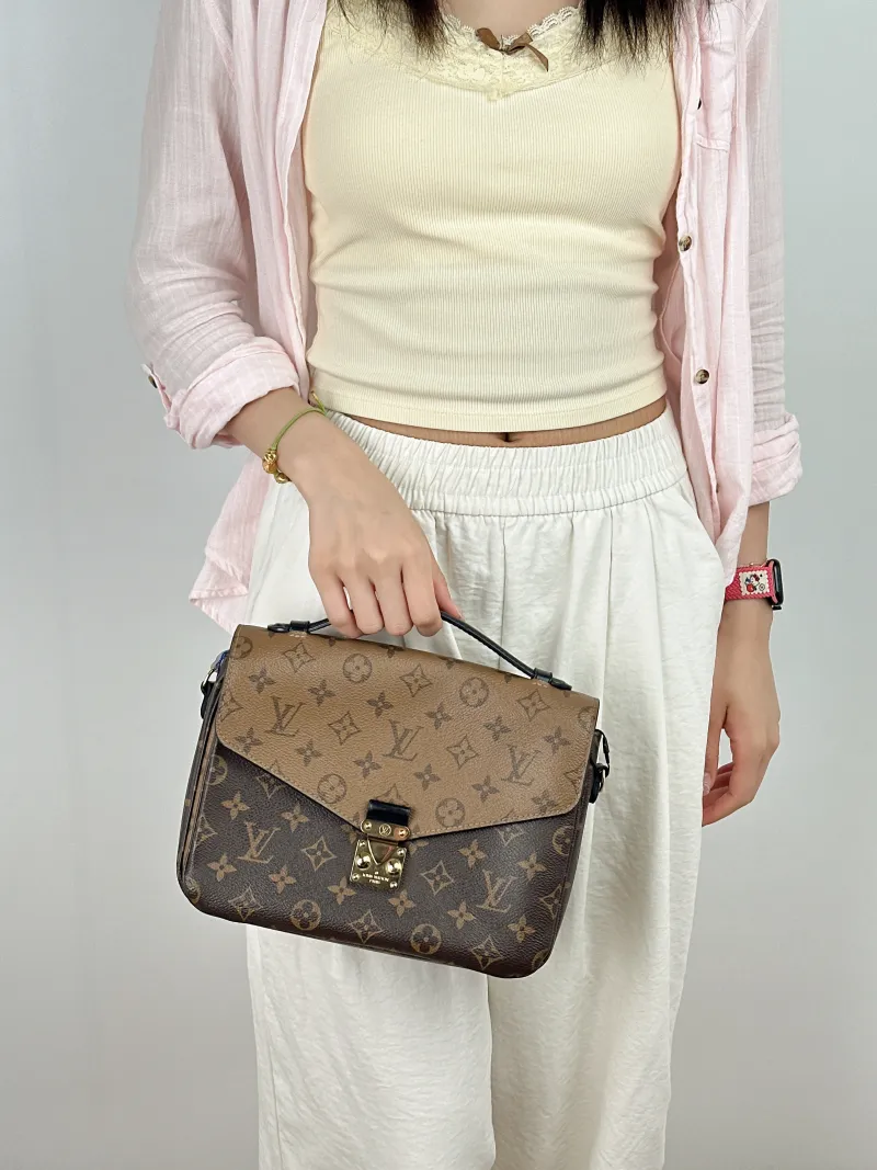 Louis Vuitton Crossbody Bag Pochette Métis Monogram Colorblock PVC Medium 25 × 7 × 19 cm — on-model view 2 of 2