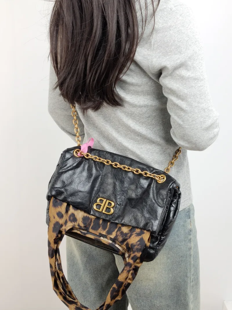 BALENCIAGA Shoulder Bag MONACO PLUS Black Calfskin Small 28 × 9 × 19 cm — on-model view 1 of 3