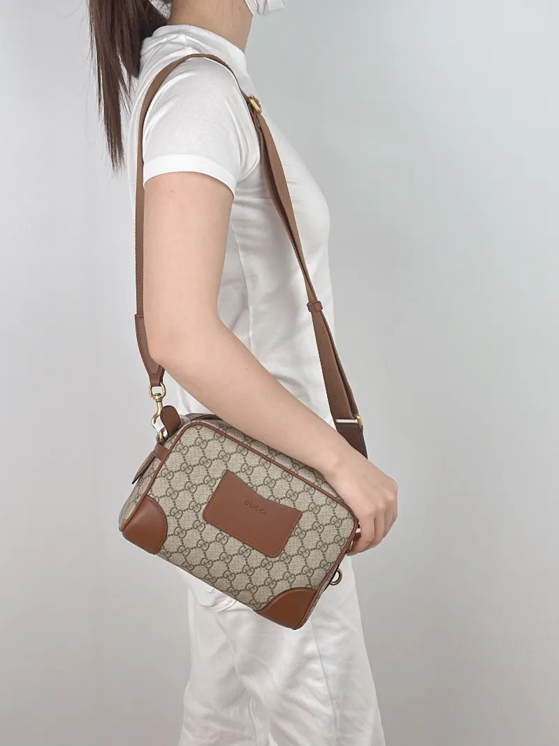 GUCCI Crossbody Bag GG Emblem Crossbody Bag Monogram PVC Small23 × 7 × 17 cm — on-model view 1 of 2