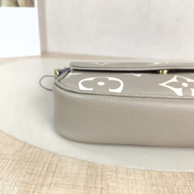 Louis Vuitton Crossbody Bag IVY Monogram Empreinte Embossed Calfskin Small 23.5 × 4.3 × 12 cm — detail view 12 of 13