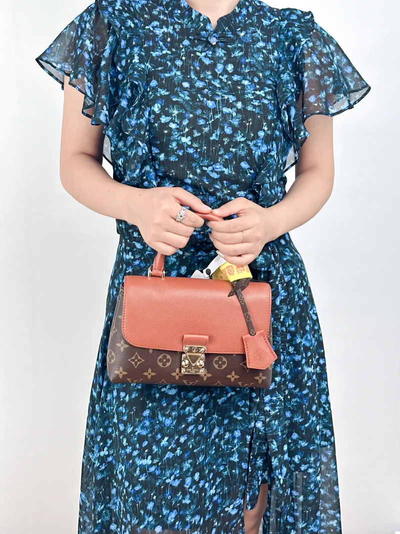 Louis Vuitton Crossbody Bag MADELEINE PVC · Calfskin BB24.5 × 8 × 16 cm — on-model view 1 of 2