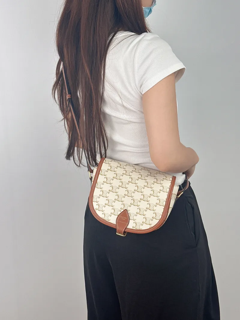 CELINE Crossbody Bag FOLCO White PVC Medium 18.5 × 8 × 17 cm — on-model view 1 of 2