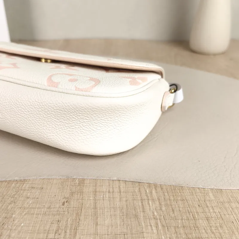 Louis Vuitton Crossbody Bag IVY White · Pink Monogram Empreinte Embossed Calfskin Small 23.5 × 4.3 × 12 cm — detail view 12 of 13