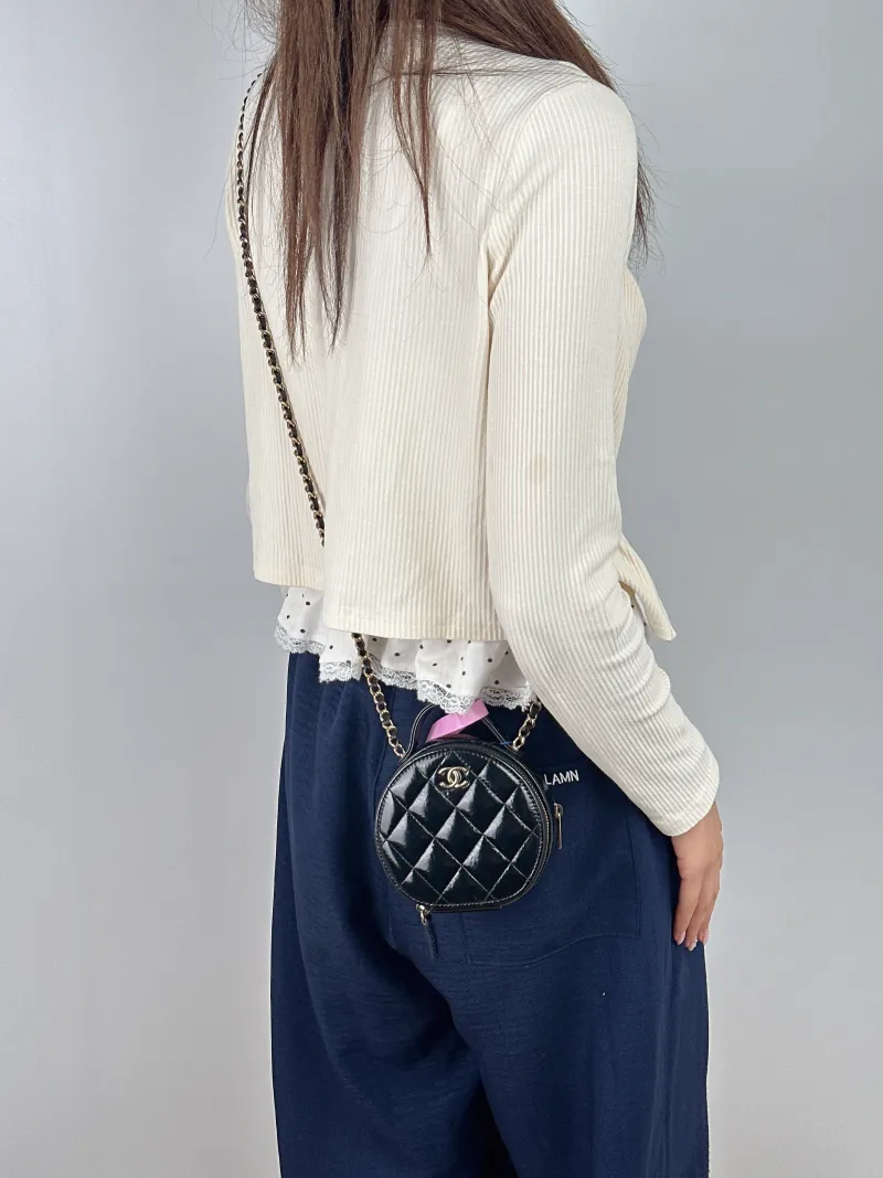 Chanel Crossbody Bag Crossbody Bag Black with Gold-Tone Hardware Waxed Leather Mini 12 × 5.5 × 11 cm — on-model view 2 of 2