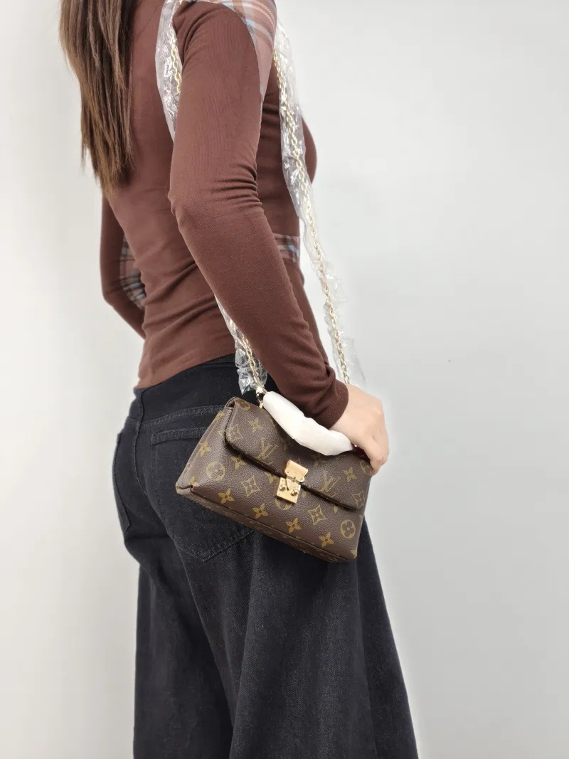 Louis Vuitton Crossbody Bag MADELEINE Monogram PVC nano 21 × 6 × 12.5 cm — on-model view 2 of 3