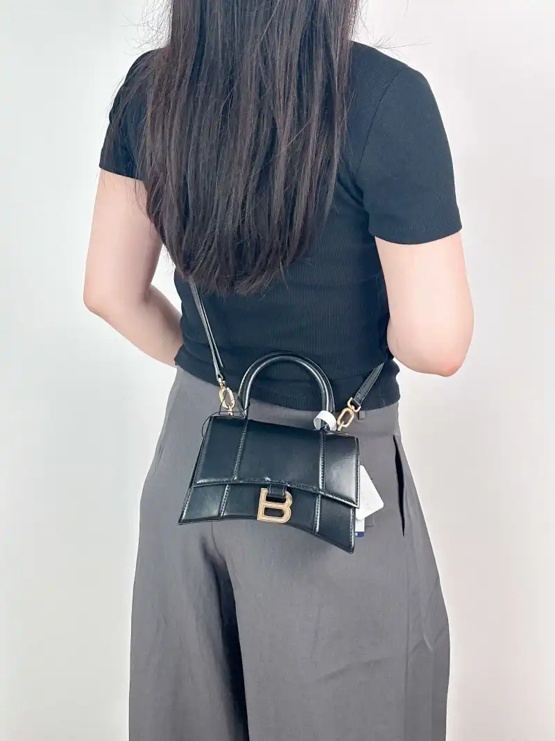 BALENCIAGA Crossbody Bag Hourglass Hourglass Bag Black Calfskin XS 19 × 8 × 13 cm — on-model view 3 of 3