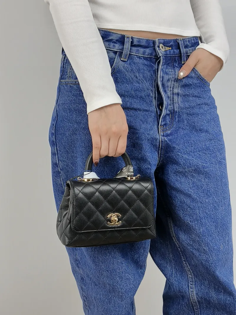 Chanel Top Handle Bag Coco Handle​ Black Grained Calfskin Mini 19 × 9 × 13 cm — on-model view 1 of 3