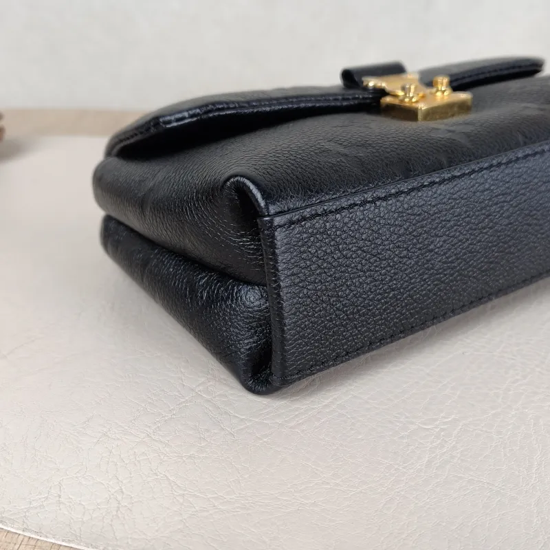 Louis Vuitton Crossbody Bag MADELEINE Black Monogram Empreinte Embossed Calfskin nano 21 × 6 × 12.5 cm — detail view 7 of 11
