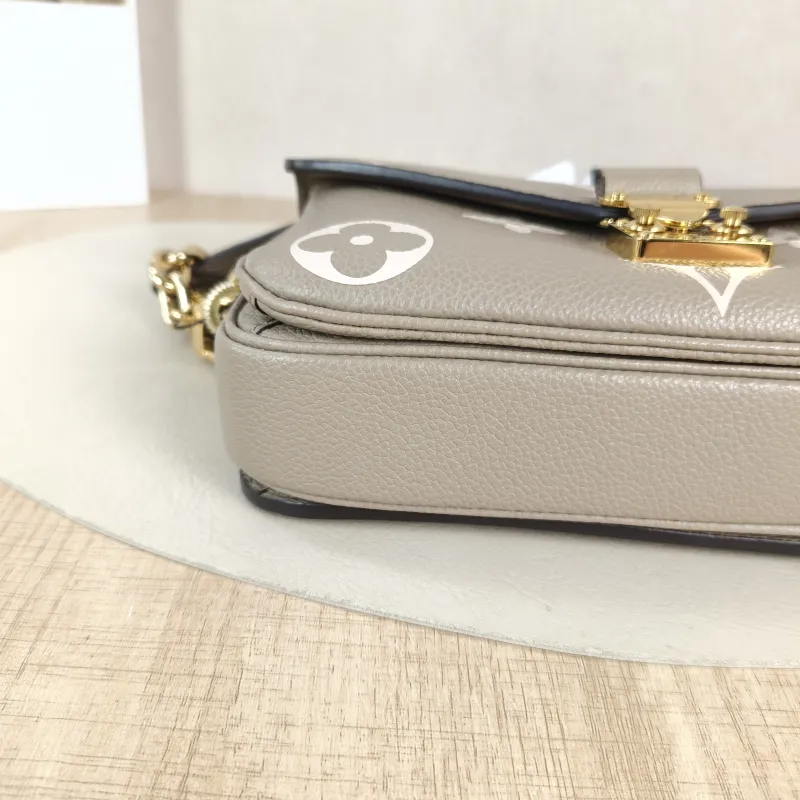 Louis Vuitton Crossbody Bag Pochette Métis East West Monogram Empreinte Embossed Calfskin Small 21.5 × 6 × 13.5 cm — detail view 3 of 12