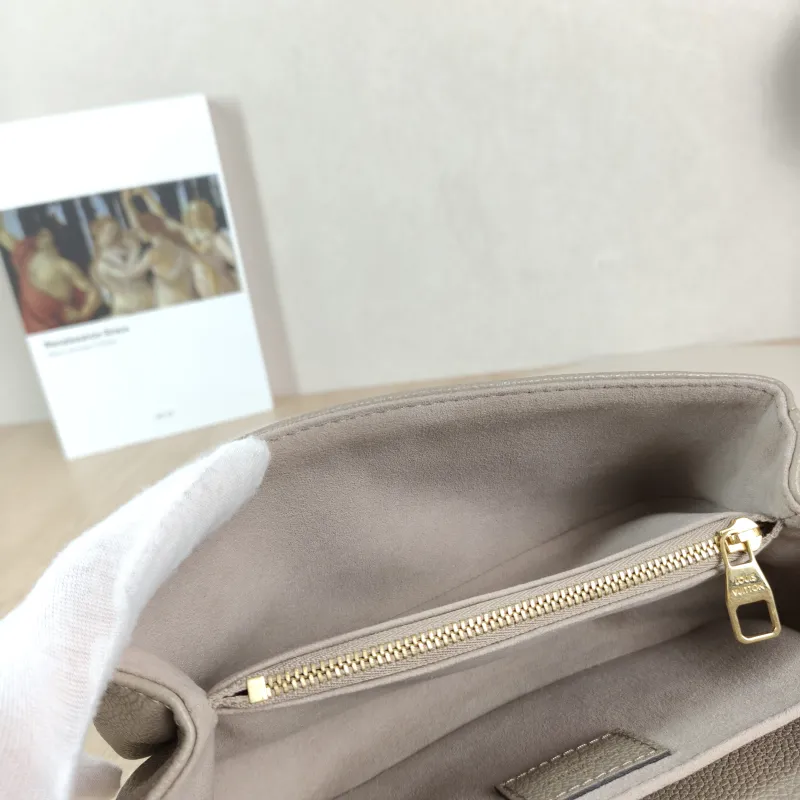 Louis Vuitton Crossbody Bag Pochette Métis East West Monogram Empreinte Embossed Calfskin Small 21.5 × 6 × 13.5 cm — detail view 11 of 12