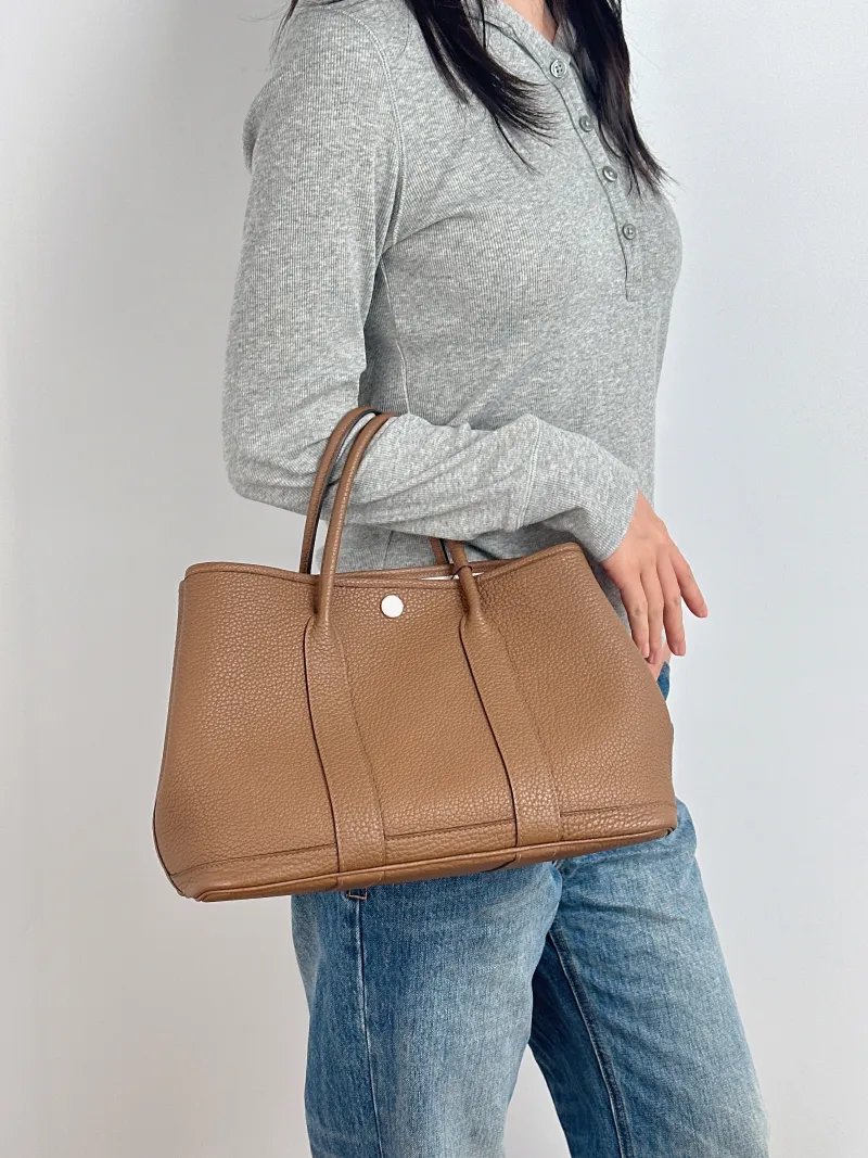 Hermès Top Handle Bag Garden Party 30 30 Negonda Calfskin Medium 30 × 13 × 21 cm B — on-model view 2 of 2