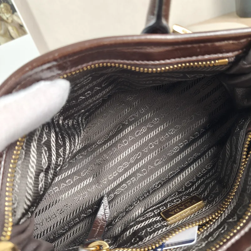 PRADA Top Handle Bag Bonnie Soft Lux Brown Waxed Leather Mini 23.5 × 9 × 12 cm — detail view 11 of 13
