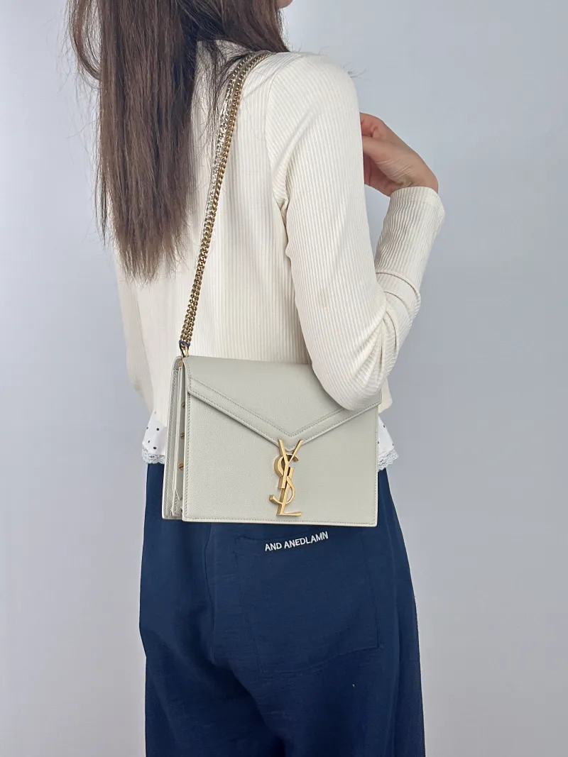 SAINT LAURENT Crossbody Bag Cassandra White Grained Calfskin Medium 22 × 5.5 × 16.5 cm — on-model view 1 of 2