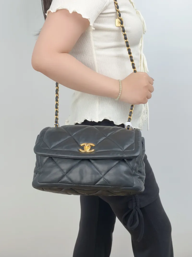 Chanel Crossbody Bag C Black Lambskin Small 28 × 9.5 × 17 cm — on-model view 2 of 3